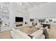 Expansive living room showcasing fireplace, and connecting dining and kitchen at 4308 W Beach Park Dr, Tampa, FL 33609