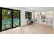 Bright office space features a large sliding glass door, pool view, and built-in shelves at 4308 W Beach Park Dr, Tampa, FL 33609