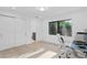 Bright office space with a large window, natural light, and sliding door closet at 4308 W Beach Park Dr, Tampa, FL 33609