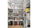 Spacious walk-in pantry featuring ample shelving for optimal storage and organization in this modern home at 4308 W Beach Park Dr, Tampa, FL 33609