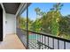 Enclosed patio featuring an overview of the pool and tropical garden at 4308 W Beach Park Dr, Tampa, FL 33609