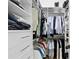 Custom closet with built-in storage, ample hanging space, and multiple shelves for shoes, bags, and accessories at 4308 W Beach Park Dr, Tampa, FL 33609