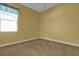 Bedroom with a large window letting in ample sunlight at 4823 Deer Lodge Rd, New Port Richey, FL 34655