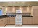 Kitchen with white cabinets, granite counters and white appliances at 4823 Deer Lodge Rd, New Port Richey, FL 34655