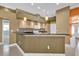 Kitchen featuring an eat in bar, white cabinets, granite counters and white appliances at 4823 Deer Lodge Rd, New Port Richey, FL 34655