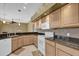 Kitchen featuring white cabinets, granite counters and white appliances at 4823 Deer Lodge Rd, New Port Richey, FL 34655