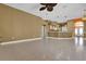 Large open concept living room with tiled floors and open flow into the kitchen at 4823 Deer Lodge Rd, New Port Richey, FL 34655
