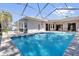 Relaxing screened-in pool with plenty of room for outdoor living and entertaining at 4823 Deer Lodge Rd, New Port Richey, FL 34655