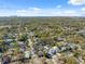 Beautiful aerial view showcases neighborhood homes and tree coverage with downtown in the distance at 502 W Hanna Ave, Tampa, FL 33604