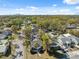 Beautiful aerial view showcases neighborhood homes and tree coverage with downtown in the distance at 502 W Hanna Ave, Tampa, FL 33604