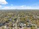 Beautiful aerial view showcases neighborhood homes and tree coverage with downtown in the distance at 502 W Hanna Ave, Tampa, FL 33604