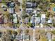 A high aerial view of neighborhood homes and tree lined streets at 502 W Hanna Ave, Tampa, FL 33604