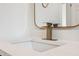 Modern bathroom sink with gold faucet and quartz countertops at 502 W Hanna Ave, Tampa, FL 33604