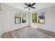 Bright bedroom featuring hardwood floors and a ceiling fan at 502 W Hanna Ave, Tampa, FL 33604