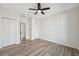 Bedroom with hardwood floors and ceiling fan at 502 W Hanna Ave, Tampa, FL 33604
