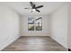 A bright bedroom with neutral walls, wood-look flooring, and natural lighting at 502 W Hanna Ave, Tampa, FL 33604