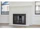 White brick fireplace with dark metal screen at 502 W Hanna Ave, Tampa, FL 33604