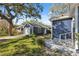 Exterior view of the detached garage with blue siding at 502 W Hanna Ave, Tampa, FL 33604