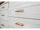 Kitchen cabinets with gold hardware at 502 W Hanna Ave, Tampa, FL 33604