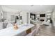 Open floor plan features a modern kitchen, dining area, and cozy living room with fireplace at 502 W Hanna Ave, Tampa, FL 33604