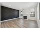 Bright living room with a fireplace and stylish decorative wall at 502 W Hanna Ave, Tampa, FL 33604