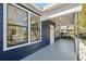 Inviting covered porch with views from the windows, blending indoor-outdoor living at 502 W Hanna Ave, Tampa, FL 33604