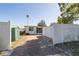 View of the house and backyard, featuring a brick paved area and green storage shed at 5221 4Th N Ave, St Petersburg, FL 33710