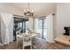Dining area with backyard views through sliding glass doors that fill the room with natural light at 5441 Worthington Loop, Palm Harbor, FL 34685