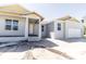 New construction home featuring a covered entry, a two-car garage, and a clean, modern design in progress at 59 Mark Twain Ln, Rotonda West, FL 33947