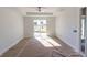 Bright main bedroom with a ceiling fan, recessed lighting, a large sliding door leading to the exterior at 59 Mark Twain Ln, Rotonda West, FL 33947