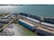 Wide aerial shot showcases waterfront condos with a private marina, and convenient covered parking in a prime location at 5925 Shore S Blvd # 503, Gulfport, FL 33707