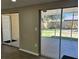 Sliding glass doors that lead to an enclosed patio and fenced yard at 6733 Carnelian Ave, New Port Richey, FL 34653