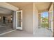 Private outdoor balcony area with sliding glass door, stucco wall, and wrought iron railing at 7309 Night Heron Dr, Land O Lakes, FL 34637
