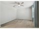 The bedroom has carpet, a fan, and large window at 7309 Night Heron Dr, Land O Lakes, FL 34637