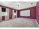 Media room with a ceiling fan, carpet, and a blank screen for movie nights at 7309 Night Heron Dr, Land O Lakes, FL 34637