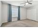 Bedroom features carpet, a fan, large window, and a closet at 7309 Night Heron Dr, Land O Lakes, FL 34637