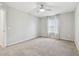 Bedroom featuring neutral carpet, ceiling fan, and large window at 7309 Night Heron Dr, Land O Lakes, FL 34637