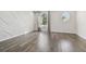 Bright, modern living room with large windows and hardwood flooring at 7309 Night Heron Dr, Land O Lakes, FL 34637