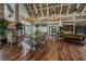 Open lounge featuring tables, a fireplace, and large windows, perfect for gatherings and relaxation at 7309 Night Heron Dr, Land O Lakes, FL 34637