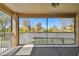 Covered patio featuring a view of the lush landscaping and a comfortable outdoor rug at 7309 Night Heron Dr, Land O Lakes, FL 34637