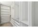 Bright walk-in closet with custom storage at 7309 Night Heron Dr, Land O Lakes, FL 34637