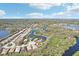High angle showcases a neighborhood of attractive homes surrounding picturesque ponds and lush greenery at 8057 Rio Bella Pl, Bradenton, FL 34201
