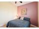 Bedroom with a full bed, side table with lamp, floral wall art, and neutral carpet for a comfortable feel at 8057 Rio Bella Pl, Bradenton, FL 34201