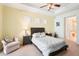 Bright and sunny bedroom with tray ceiling, ceiling fan, and neutral colors at 8057 Rio Bella Pl, Bradenton, FL 34201
