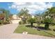 Lovely single-story home with a brick driveway, a two-car garage, and beautifully landscaped front yard at 8057 Rio Bella Pl, Bradenton, FL 34201