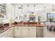 Bright kitchen view with granite countertop and stainless steel appliances at 8057 Rio Bella Pl, Bradenton, FL 34201