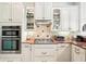 Kitchen features stainless steel appliances, granite countertops, and white cabinets at 8057 Rio Bella Pl, Bradenton, FL 34201