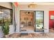 View of the living room from the patio, showcasing the open floor plan and view of the pool at 8057 Rio Bella Pl, Bradenton, FL 34201