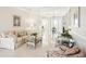 Open-concept living space with tile floors, neutral colors, and ample natural light at 8057 Rio Bella Pl, Bradenton, FL 34201