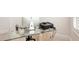 Close up of desk in bright office space, natural light, and tile flooring at 8057 Rio Bella Pl, Bradenton, FL 34201